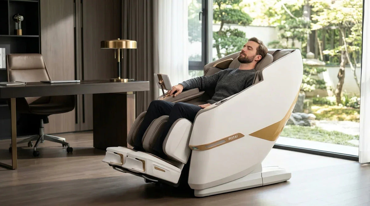 Man relaxing in luxury full body massage chair in modern home office with garden view